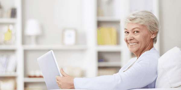 older woman reading a book